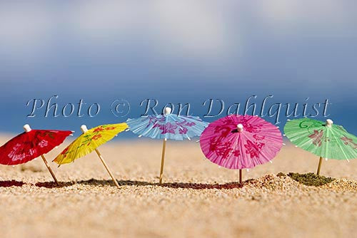 Colorful cocktail umbrellas in the sand, Hawaii - Hawaiipictures.com