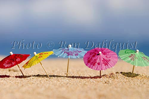 Colorful cocktail umbrellas in the sand, Hawaii - Hawaiipictures.com Colorful cocktail umbrellas in the sand, Hawaii - Hawaiipictures.com