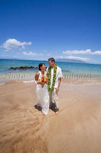 Hawaiian wedding. Newly married couple walking on the beach, Makena, Maui, Hawaii - Hawaiipictures.com Hawaiian wedding. Newly married couple walking on the beach, Makena, Maui, Hawaii - Hawaiipictures.com