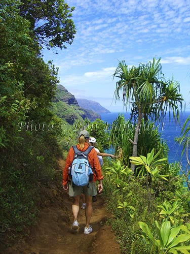 Hikers on the Kalalau Trail which runs along the Na Pali coast. Kauai, Hawaii Picture - Hawaiipictures.com