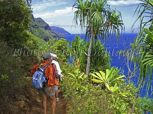 Hikers on the Kalalau Trail which runs along the Na Pali coast. Kauai, Hawaii - Hawaiipictures.com