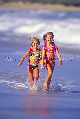 Young girls running on the beach, Maui, Hawaii - Hawaiipictures.com