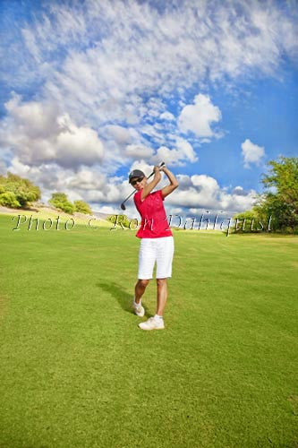 Woman golfing on The Challenge at Manele Golf Course, Lanai, Hawaii Picture - Hawaiipictures.com