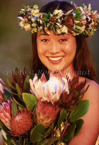 Lovely teenage girl on Maui with bouquet of protea flowers and Haku lei, Hawaii - Hawaiipictures.com