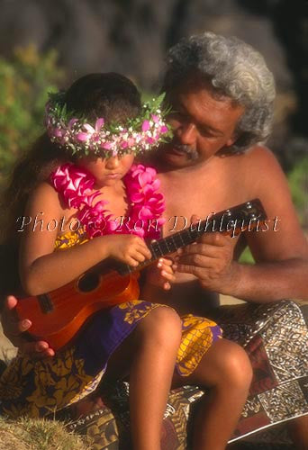 Father teaching daughter to play the ukulele, Maui, Hawaii - Hawaiipictures.com