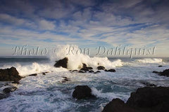 Surf breaking on the rocks at Ho'okipa on the north shore of Maui, Hawaii