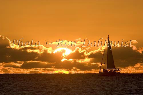 Silhouette of sailboat at sunset, Kauai, Hawaii - Hawaiipictures.com