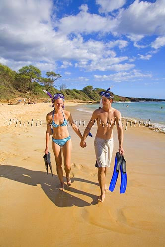 Couple walking on Little Beach after snorkeling. Makena, Maui, Hawaii MR - Hawaiipictures.com