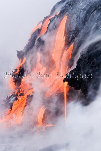 Molten pahoehoe lava from Kilauea enters the Pacific Ocean near Kalapana, Big Island of Hawaii. Stock Photo - Hawaiipictures.com