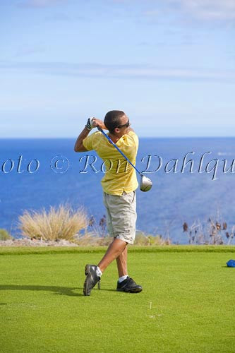 Young man hitting a tee shot at The Challenge at Manele golf course, Lanai, Hawaii - Hawaiipictures.com Young man hitting a tee shot at The Challenge at Manele golf course, Lanai, Hawaii - Hawaiipictures.com
