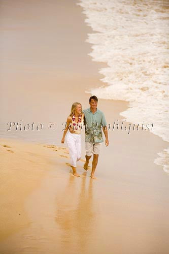 Honeymoon couple having fun at beautiful Oneloa Beach (Big Beach) on Maui, Hawaii - Hawaiipictures.com