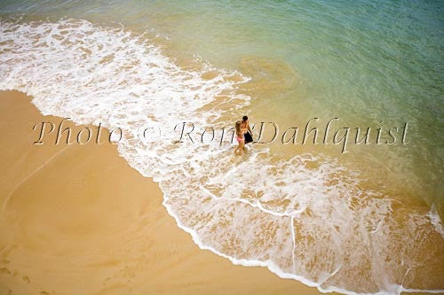 Honeymoon couple having fun at beautiful Oneloa Beach (Big Beach) on Maui, Hawaii Picture Photo - Hawaiipictures.com