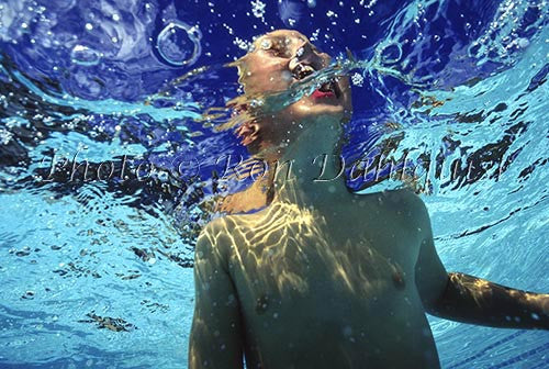 Young boy, swimming, at resort pool, Maui, Hawaii - Hawaiipictures.com