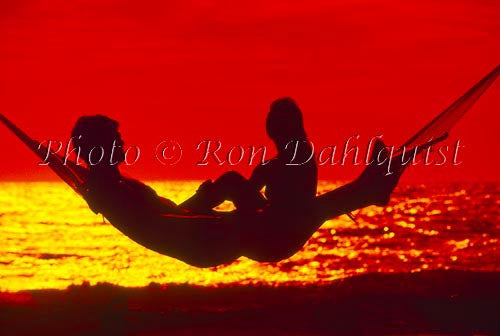Silhouette of couple in hammock at sunset, Maui, Hawaii - Hawaiipictures.com
