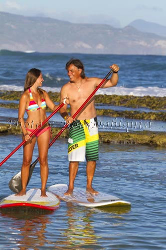 Coulple stand-up paddle boarding on Maui, Hawaii - Hawaiipictures.com