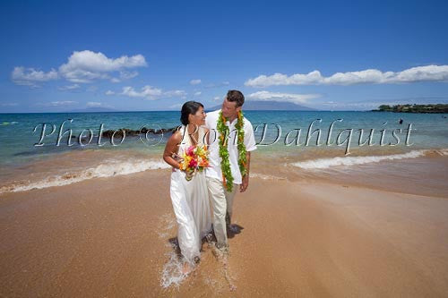 Hawaiian wedding. Newly married couple walking on the beach, Makena, Maui, Hawaii Picture - Hawaiipictures.com