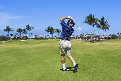 Man golfing on the Mauna Lanai Golf Course, Big Island of Hawaii - Hawaiipictures.com
