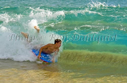 Teenager body boarding in the waves at Big Beach, Oneloa Beach, Makena, Maui, Hawaii - Hawaiipictures.com