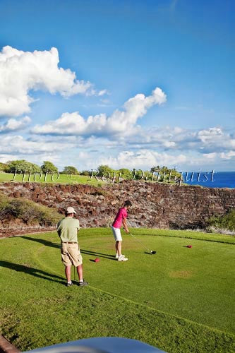 Woman golfing on The Challenge at Manele Golf Course, Lanai MR - Hawaiipictures.com