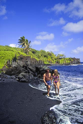 Honeymoon couple, walking on Black Sand Beach at Waianapanapa State Park, Hana, Maui, Hawaii - Hawaiipictures.com