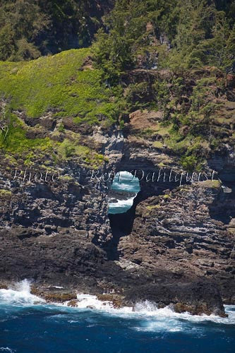 Aerial of hole in rocky coastline of the north shore of Maui, Hawaii - Hawaiipictures.com
