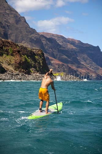 Stand-up paddling along the NaPali coastline of Kauai, Hawaii Picture - Hawaiipictures.com