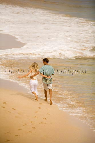 Honeymoon couple having fun at beautiful Oneloa Beach (Big Beach) on Maui, Hawaii Picture - Hawaiipictures.com