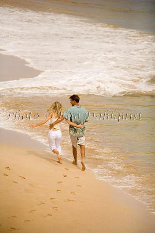 Honeymoon couple having fun at beautiful Oneloa Beach (Big Beach) on Maui, Hawaii Picture - Hawaiipictures.com