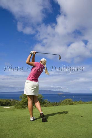 Woman golfing at Wailea Gold Golf Course, Maui, Hawaii Photo - Hawaiipictures.com