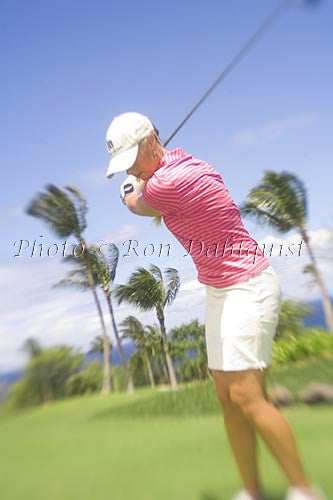 Woman playing golf at the Wailea Gold Golf Course, Wailea, Maui, Hawaii Photo - Hawaiipictures.com