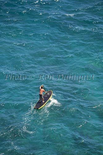 Man stand-up paddle boarding over shallow reef on Lanai, Hawaii - Hawaiipictures.com