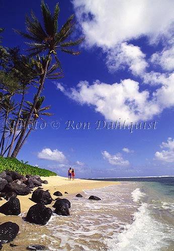 Couple on secluded beach in east Molokai, Hawaii - Hawaiipictures.com