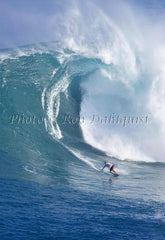 Surfer on a big day at Peahi, also known as Jaws, Maui, Hawaii MNR